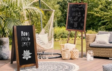 Pillows,On,Hammock,On,Terrace,With,Round,Rug,And,Rattan Pillows on hammock on terrace with round rug and rattan sofa in the garden. Real photo